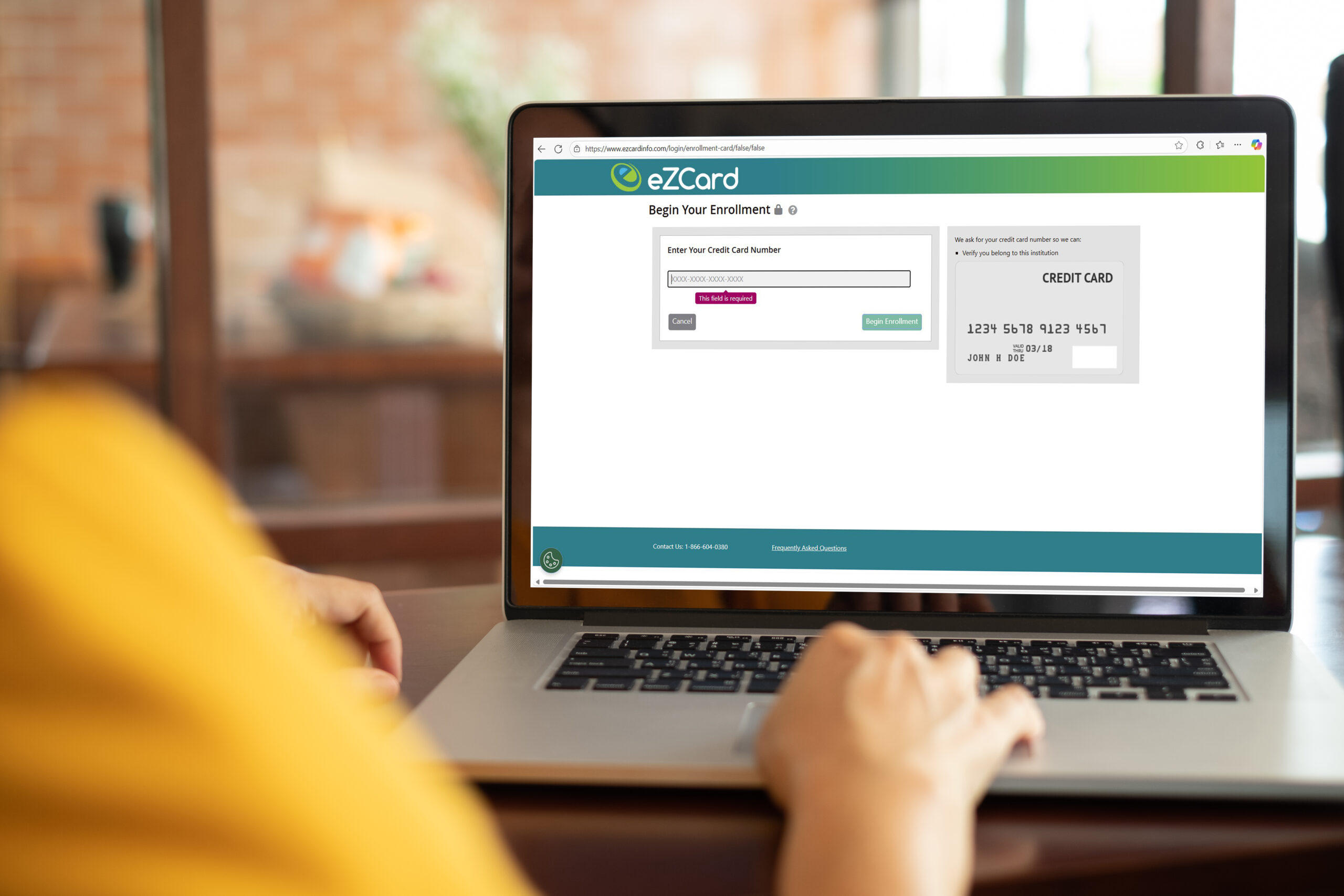 Women,Using,Laptop,Computer,Working,At,Home,With,Blank,White Person sitting at computer looking at computer screen with the eZCard Info Login website.